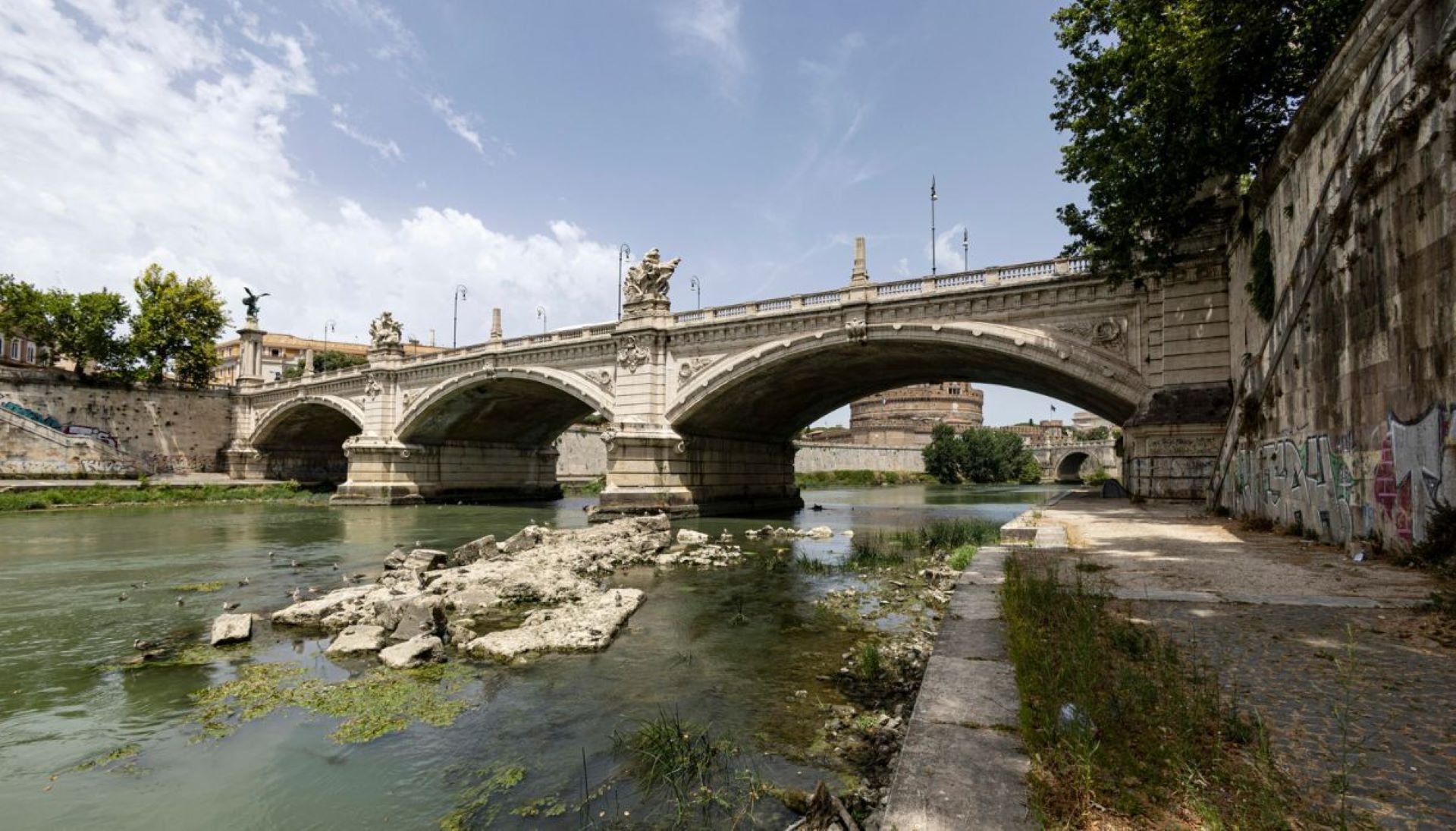 Ruins appear from the dry bed of the Tiber tuour guide Neronian bridge